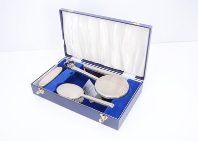 Lot 384 - A modern three piece silver filled dressing table set