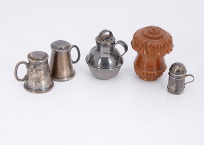 Lot 387 - Four miniature silver peppers and a silver thimble