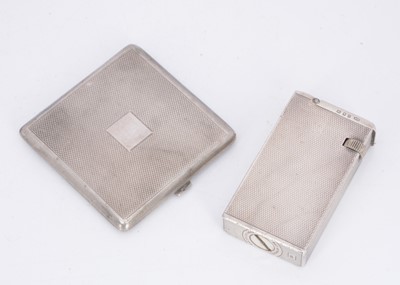 Lot 390 - An Art Deco period silver cigarette lighter by Alfred Dunhill and a silver compact