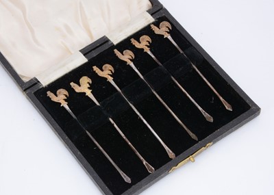 Lot 398 - A cased set of six silver cocktail picks