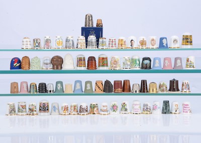 Lot 419 - A large collection of porcelain and other thimbles together with 3 glass domed displays