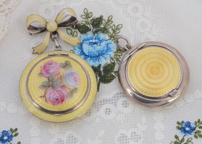 Lot 459 - A yellow guilloche enamel decorated silver brooch or pendant compact