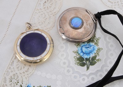 Lot 468 - Two circular silver pendant compacts