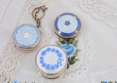 Lot 474 - Three circular silver blue guilloche enamel mounted compacts