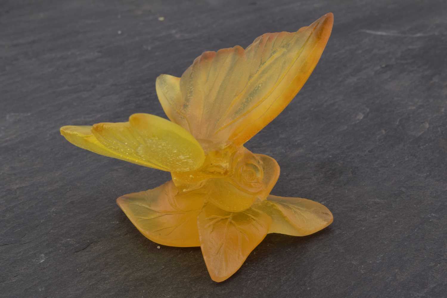 Lot 503 - A Daum Nancy pate-de-verre yellow glass model of a butterfly on a rose