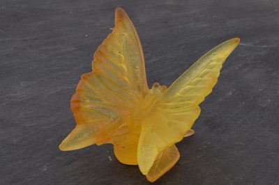 Lot 503 - A Daum Nancy pate-de-verre yellow glass model of a butterfly on a rose