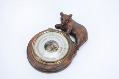 Lot 156 - A Black Forest carved wooden bear barometer