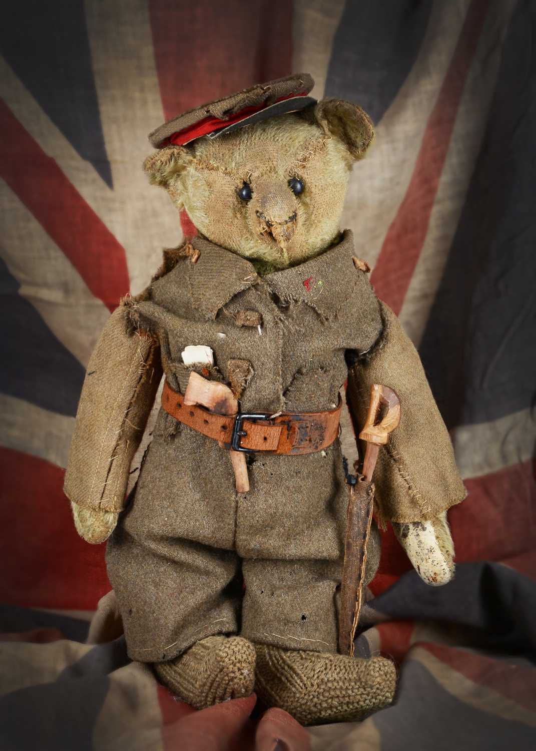 Lot 170 - Captain Bruiny, a rare Steiff teddy bear, circa 1908, home dressed in 1st World War British uniform and provenance