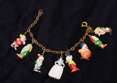 Lot 304 - Walt Disney Snow White and the Seven Dwarves plastic charm bracelet, circa 1938