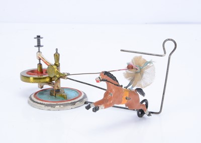 Lot 337 - An early Britains 'The Equestrienne' flywheel operated lead toy, circa 1900