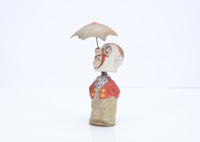 Lot 404 - A pressed card clockwork clown