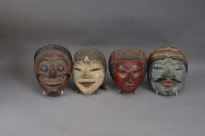 Lot 223 - A collection of four Indonesian hand painted and carved theatre masks