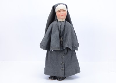 Lot 498 - A cloth doll dressed as a nun