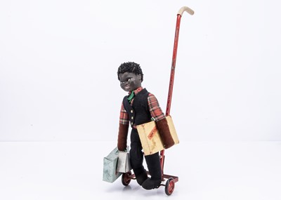 Lot 508 - A rare Dean’s Rag Book Co Luggage Lucas push-along walking porter doll, circa 1962