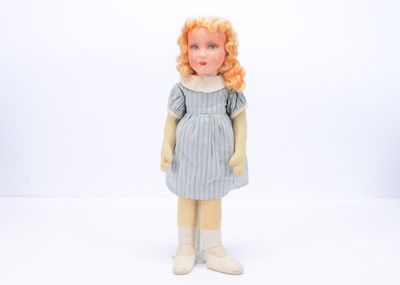 Lot 520 - A cloth girl doll