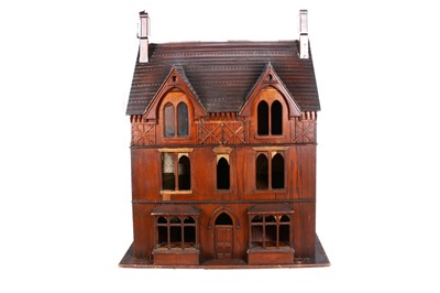 Lot 558 - A late Victoria dark stained pitch pine Gothic dolls’ house