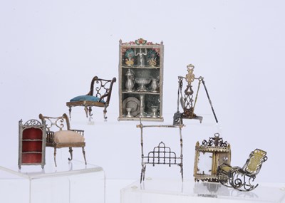 Lot 567 - Late 19th century soft metal dolls’ house furniture