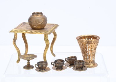 Lot 576 - A gilt metal dolls’ house chess table