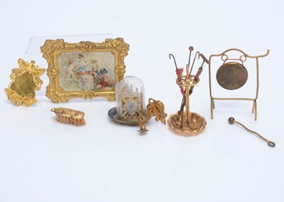 Lot 615 - German gilt metal dolls’ house chattels