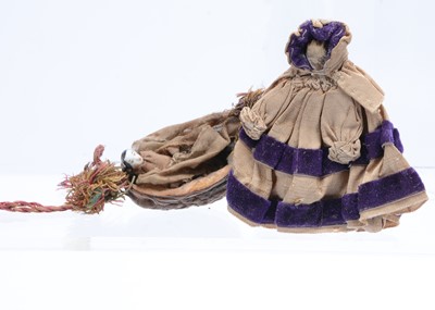 Lot 632 - An 19th century china Frozen Charlotte doll in half a walnut shell