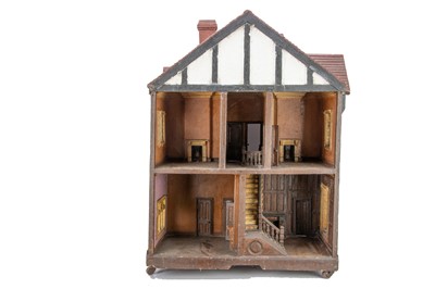 Lot 648 - An unusual 1930s well-modelled mock Tudor dolls’ house