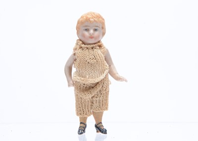 Lot 663 - An all-bisque boy dolls’ house doll