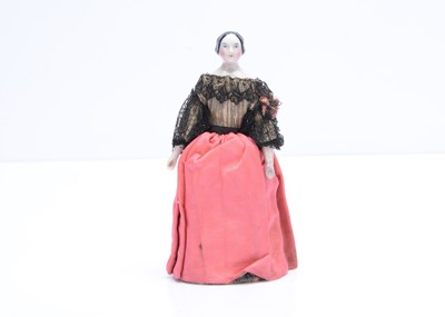 Lot 665 - An 19th century German china shoulder-head dolls’ house doll