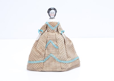 Lot 666 - An 19th century German china shoulder-head dolls’ house doll