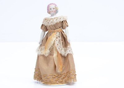 Lot 669 - An 19th century German bisque shoulder-head dolls’ house doll