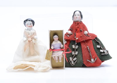 Lot 675 - Three Frozen Charlotte dolls’ house dolls