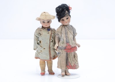 Lot 676 - A German bisque headed Asian dolls’ house doll couple