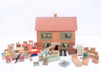 Lot 693 - A post-war small paper covered wooden dolls’ house