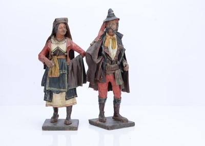 Lot 805 - A pair of Italian painted papier-mâché traditionally dressed figures, probably late 19th century