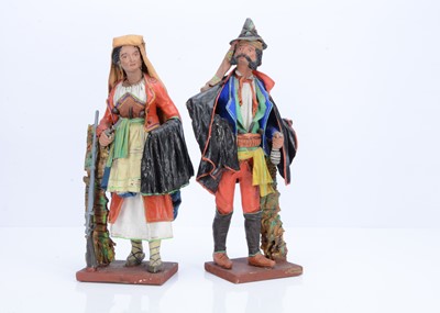 Lot 806 - A pair of Italian painted papier-mâché traditionally dressed figures, circa 1900