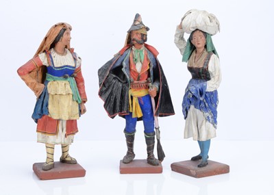 Lot 807 - Three Italian painted papier-mâché traditionally dressed figures, circa 1900