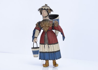 Lot 808 - An interesting late 19th century carved wooden headed figure with toleware clothings