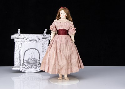 Lot 811 - An early German pink tinted china shoulder head doll