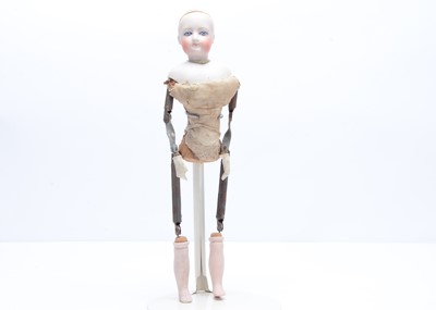 Lot 819 - A Gaultier bisque swivel head fashion doll