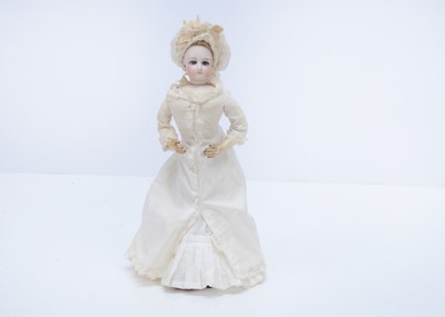 Lot 820 - A small French swivel head fashion doll