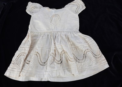 Lot 851 - A mid 19th century white cotton child’s dress