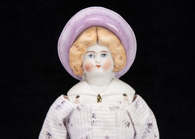 Lot 907 - A Hertwig bisque shoulder-head doll in moulded Sou’wester hat