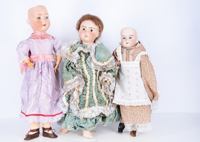 Lot 932 - Three bisque head child dolls