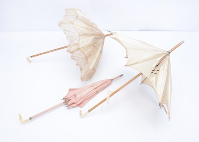 Lot 968 - Three French bebe doll’s parasols