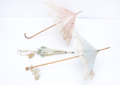 Lot 969 - Three French bebe doll’s parasols