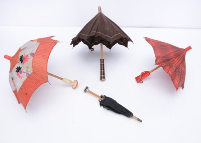 Lot 972 - Four doll’s umbrellas