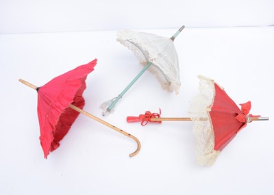 Lot 973 - Three doll’s parasols