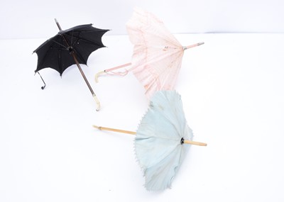 Lot 974 - Three small doll’s parasols