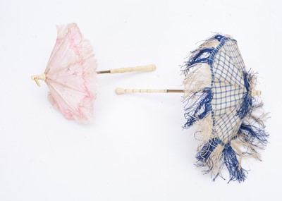 Lot 976 - Two fashion doll’s parasols with turned bone handles