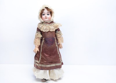 Lot 1010 - A late 19th century German bisque headed doll impressed 4