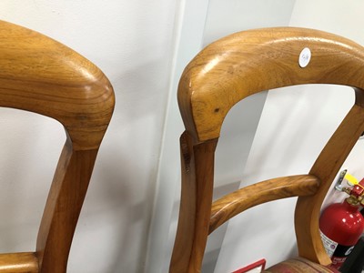 Lot 338 - A set of eight hardwood balloon back dinning room chairs